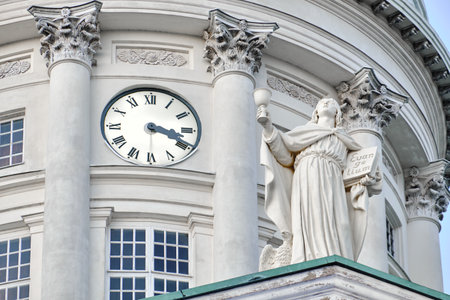 Helsinki, Finland - November 22, 2020: The close-up of Helsinki Cathedral dome clock and Sculptureのeditorial素材
