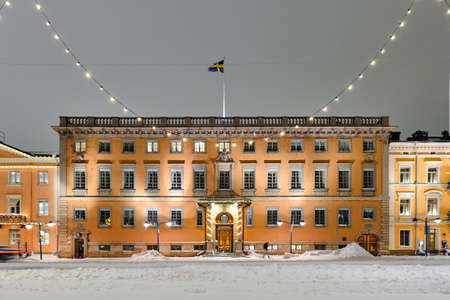 Helsinki, Finland - January 13, 2021: Embassy of Sweden in winter night with Christmas decoration in Helsinki, Finland. The beautiful old classic European architecture.のeditorial素材