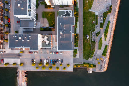Aerial view of the modern apartment buildings in Helsinki. On the embankment public park with grills. Modern Nordic Architecture in Finland.の写真素材