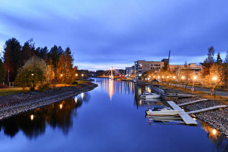 River in the residential neighborhood on an autumn evening, boats docked, Joensuu, Finland.のeditorial素材