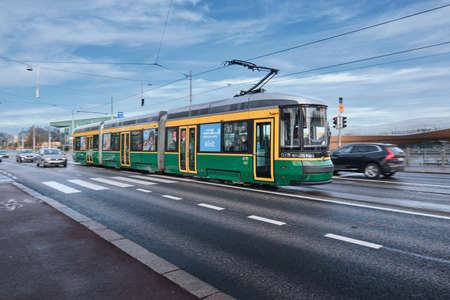 Helsinki, Finland - November 11, 2021: ForCity Smart Artic Helsinki tram on the street on a sunny autumn dayのeditorial素材