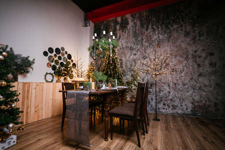 New Year 2021 interior with candles, bulbs and bokeh. Room decorated to christmas celebration....