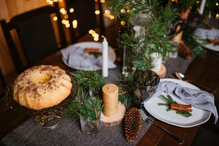 New Year 2021 interior with candles, bulbs and bokeh. Room decorated to christmas celebration. Christmas tree with presentsの写真素材