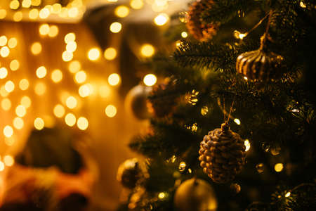 New Year 2021 interior with candles, bulbs and bokeh. Room decorated to christmas celebration....