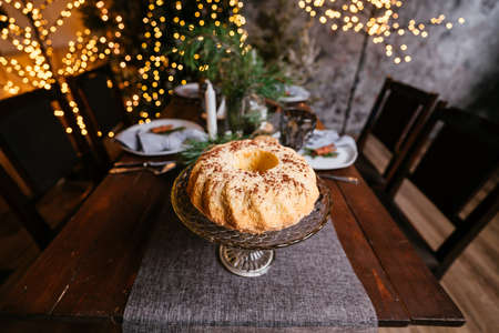 New Year 2021 interior with candles, bulbs and bokeh. Room decorated to christmas celebration. Christmas tree with presentsの写真素材