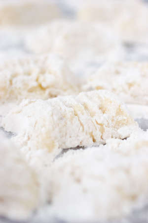 Home made potato gnocchit waiting to be boiled and servedの写真素材