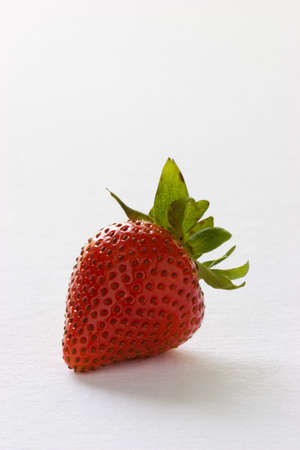 Single Strawberry on white backgroundの写真素材