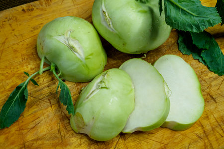 Fresh kohlrabi cutting on wooden board prepare for cooking. Brassica oleracea Gongylodes Groupの写真素材