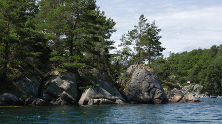 Huge boulders on the shore on a summer day.の写真素材