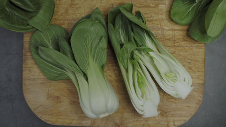 Endives on a wooden cutting board (Cichorium intybus). Fresh chicoryの写真素材