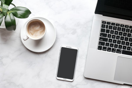 Top view of a cell phone, computer and mug with coffeeの素材