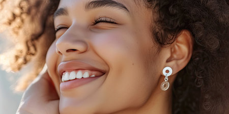 Earrings on smiling womanの素材