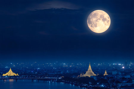 Supermoon rising over the city of Bangkok, Thailand, illuminating the Chao Phraya River and its bridgesの素材