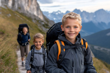 Family hiking in the Italian Dolomites enjoying summer vacationの素材