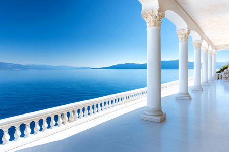 Luxury terrace with white columns overlooking beautiful blue sea and mountains in a sunny dayの素材