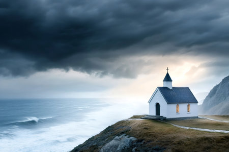 Scenic view of a small church on a cliff overlooking a stormy sea at sunset, creating a dramatic and evocative sceneの素材