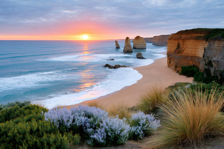 Dramatic sunset illuminating Twelve Apostles rock stacks and cliffs along the Australian coastlineの素材