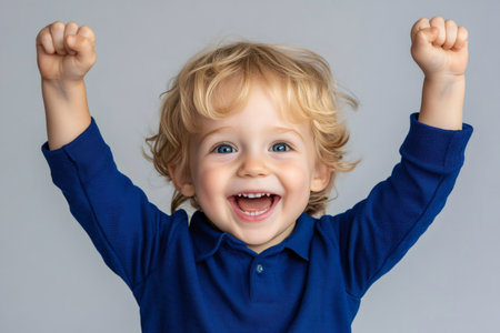 Happy boy feeling excited, winning, and expressing joy with a wide smileの素材