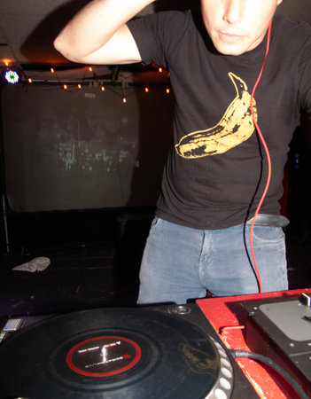 DJ playing music in a nightclub, close-up of his handsの写真素材