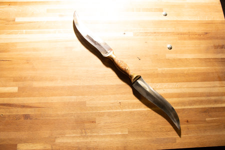 Knife on a wooden table with copy space. Top view.の写真素材