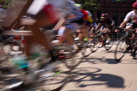 Cyclists in motion at the end of a road race.の写真素材