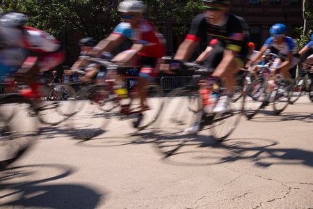 Bicyclists in motion at a bike race in the cityの写真素材