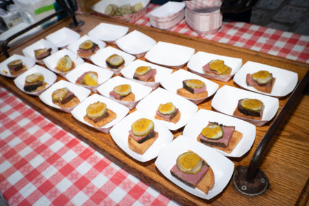 Canapes with meat and egg on the table in a restaurant.の写真素材