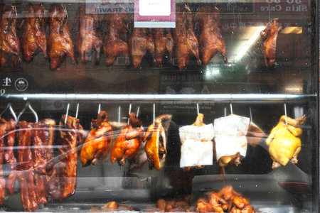 Roasted chicken in a shop window.の写真素材