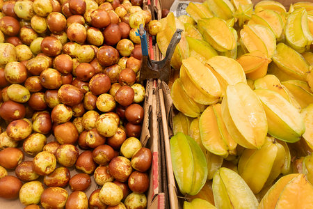 Star apple and carambola fruit on the market in Thailand.の写真素材