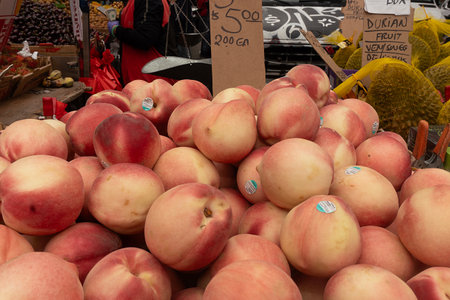 Ripe peaches for sale at a farmers market in France.の写真素材