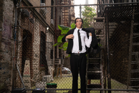 Portrait of a young businessman in an old abandoned building, wearing a suit and tie.の写真素材