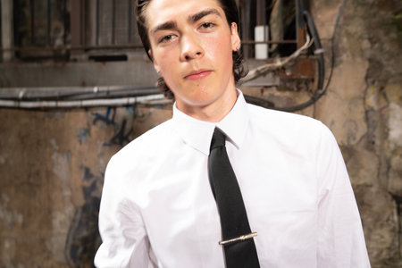 Portrait of a handsome young man in a white shirt and tieの写真素材