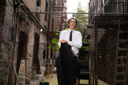 Handsome young man in white shirt and tie posing in an urban contextの写真素材