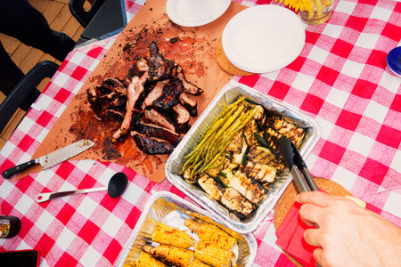 Grilled meat with asparagus and corn on the table.の写真素材