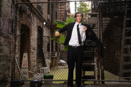 Portrait of a young business man standing in an abandoned building.の写真素材