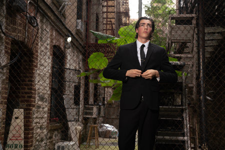 Portrait of a young businessman in a dark suit and tie.の写真素材