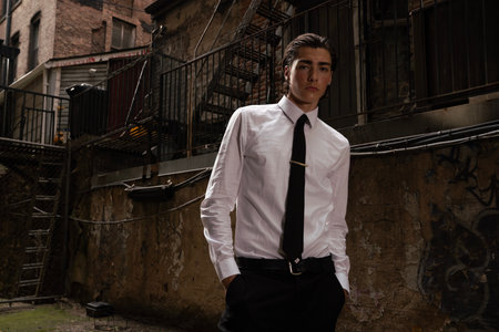 Handsome young man in white shirt and tie posing outdoor.の写真素材