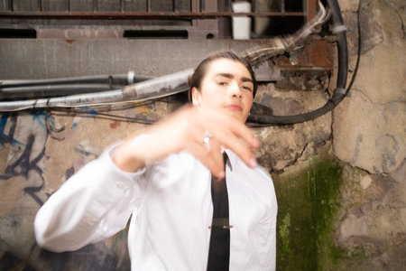 Portrait of a young person in a white shirt and black tieの写真素材