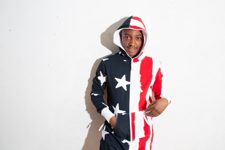Portrait of a young african american boy wearing an American flag shirtの写真素材