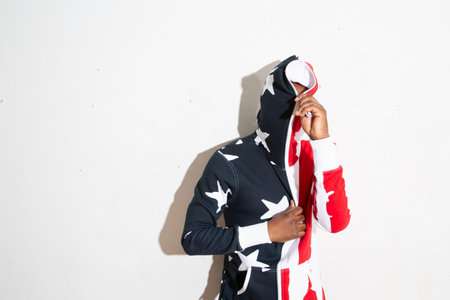 Asian muslim woman wearing hijab with american flag on white backgroundの写真素材
