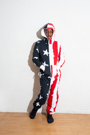 Full length portrait of a man in a costume of the American flagの写真素材
