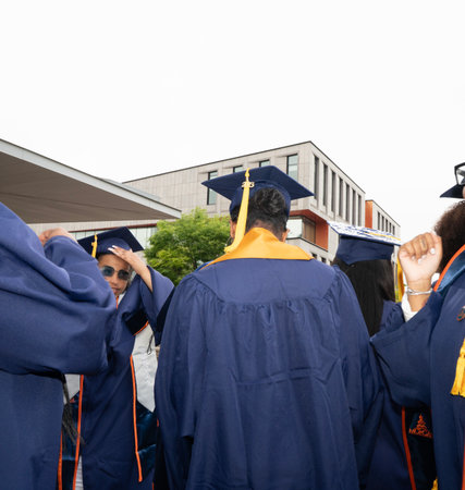 Rear view of a group of diverse students wearing graduation gownsの写真素材