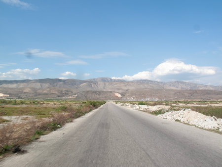 View from the car on the road to the mountains and blue sky.の写真素材