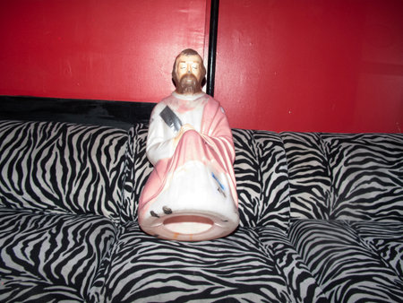 Statue of Saint Francis of Assisi on a zebra bedの写真素材