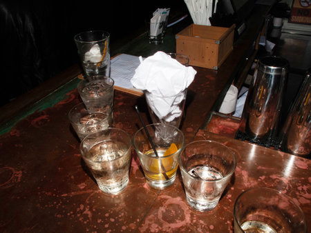 Cocktail in a bar with two glasses and a white napkinの写真素材
