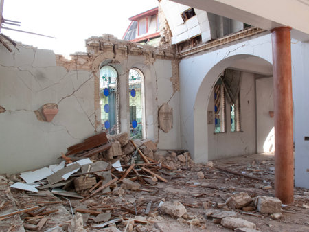 Ruins of a heavily damaged structure, showing collapsed walls and debris.の写真素材