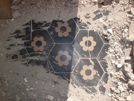Mosaic with flowers in the courtyard of an old abandoned houseの写真素材