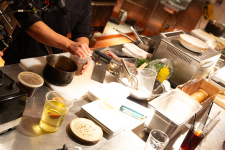 Chef preparing a meal in the kitchen of the restaurant, restaurantの写真素材