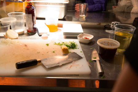 Close-up of a cook preparing food in a restaurant kitchen.の写真素材