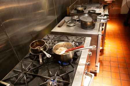 cooking food in a restaurant kitchen, chef cooking food in a restaurant kitchenの写真素材